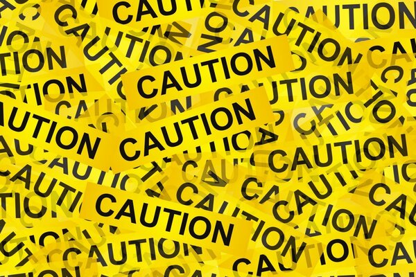 Текст «Caution» по всему экрану