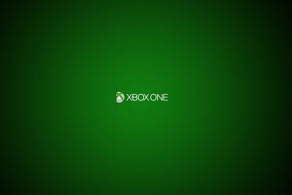 Логотип приставки Xbox One в спотлайте на зеленом фоне
